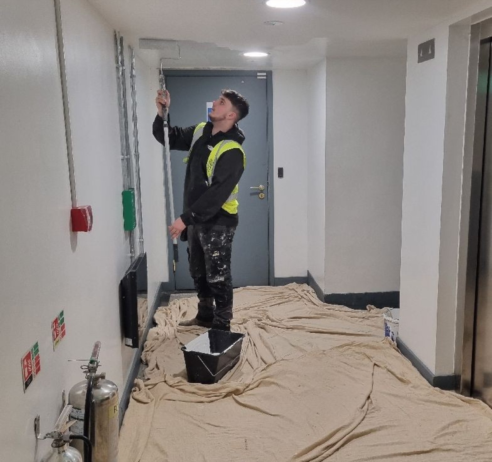Lime team member completing ceiling works on site